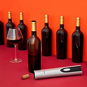 Wine Opener and Wine Bottles on Orange Background