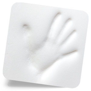 Hand indentation on white memory foam of car cushion