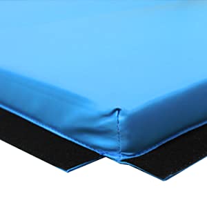 Close up on the corner of a blue PRISP gymnastics mat. Interlocking velcro strips shown