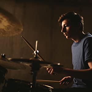 Teen Playing Drums