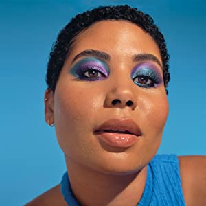 Annabelle Cosmetics - Black woman wearing colorful blue and purple eye makeup