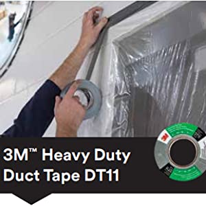 Hand applying 3M Heavy Duty Duct Tape DT11 around a window