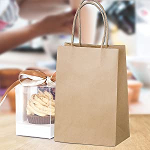 Brown paper bag on countertop with wrapped packaged food 