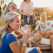 Group of confident women in summertime; one in three women experiences bladder leaks.