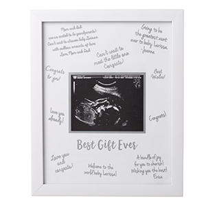 White sonogram frame with family and friends signatures written on it